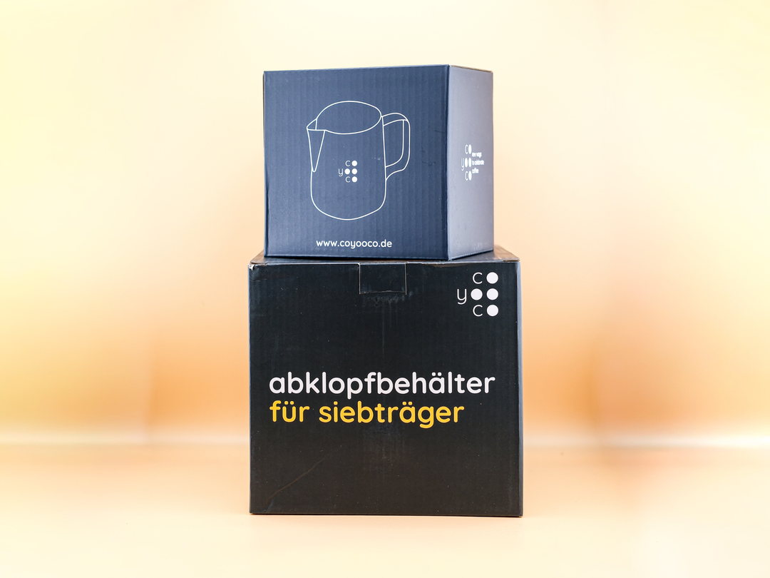 Latte Art Starter Set containing a milk jug and knock box for espresso preparation.